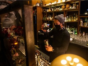 Thirteen Pies co-owner Jacob Grasby mixes a non-alcoholic cocktail using a ginger shrub. A shrub is a mixture that combines fruit, aromatics, sugar and vinegar.