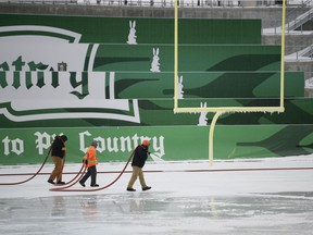 Crews work to make an enormous skating rink at Mosaic Stadium. Registration for the public skate starts today; the first skate is on Dec. 31.