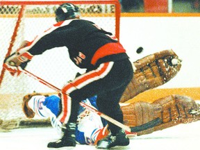 Theo Fleury of the Moose Jaw Warriors flips the puck, with his stick between his legs, over Regina Pats netminder Stacey Nickel for a highlight-reel goal during an April 9, 1986 WHL playoff game at the Agridome (now Brandt Centre).

22 March 2012 (C4) Theoren Fleury of the Moose Jaw Warriors flips the puck, with his stick stuck between his legs, over Regina Pats goalie Stacey Nickel during an April 9, 1986, WHL playoff game.



8 Feb 2008 ( C1) Theo Fleury of the Moose Jaw Warriors flips the puck, with his stick stuck between his legs, over Regina Pats goalie Stacey Nickel during an April 9, 1986, WHL playoff game.

05 Dec 2009 (C1) As a junior with the Moose Jaw Warriors of the WHL, Theoren Fleury scored a goal against Stacey Nickel of the Regina Pats with his stick between his legs.
