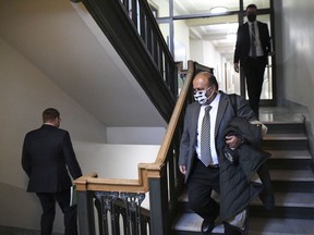 Premier Scott Moe and Chief Medical Health Officer Dr. Saqib Shahab, from left, arrive to a COVID-19 press conference at the Saskatchewan Legislative Building on Dec. 14, 2020.