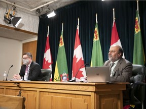 Minister of Health Paul Merriman and Chief Medical Health Officer Saqib Shahab, from left, during a COVID19 media update at the Legislative Building.