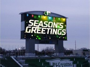 Best wishes for the holiday season are offered on the video board at Mosaic Stadium.