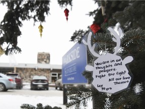 A tree is decorated with messages and Christmas tree ornaments at Parkside Extendicare on Dec. 14, 2020.