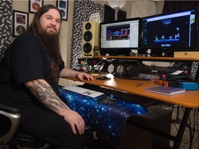 Justin Bender sits at his work station in his home in Moose Jaw, Saskatchewan on Jan. 9, 2020. Bender is a musician and sound technician who is designing a video game.