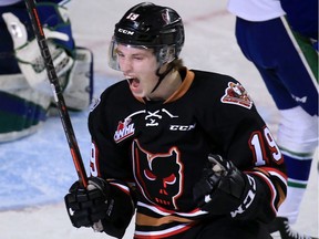 Regina's Carson Focht, shown celebrating a goal last season with the Calgary Hitmen, has signed an entry-level deal with the Vancouver Canucks.