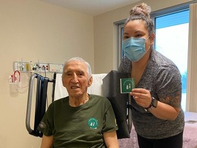 Jimmy Favel and his granddaughter, Brittany Favel, pose after both received doses of the Moderna vaccine on Tuesday, Jan. 5, 2021. Jimmy Favel lives in the Ile-a-la-Crosse Long Term Care facility and Brittany is a registered nurse. Ile-a-la-Crosse is a community of about 1,600 people in northern Saskatchewan about 300 kilometres northwest of Prince Albert. (Saskatchewan Ministry of Health)