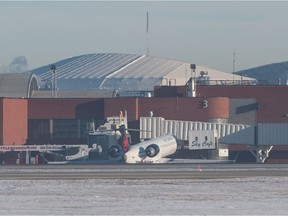 An Air Canada Jet sits at a terminal at the Regina International Airport in Regina, Saskatchewan on Jan. 8. 2020.