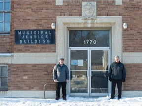 Retired Regina Police Service Staff Sgt. Bob Koroluk, left, and retired member Const. Marv Kereluke stand in front of the former Municipal Justice Building on Halifax Street in Regina, Saskatchewan on Jan. 8, 2020.