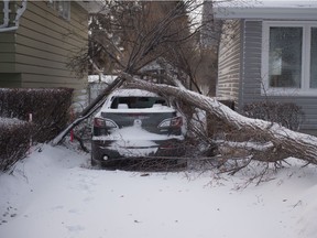 A vehicle sits damaged at the corner of Pells Drive and Parker Avenue in Regina, Saskatchewan on Jan. 13, 2020. Following rain, road conditions in the city were very slippery.
