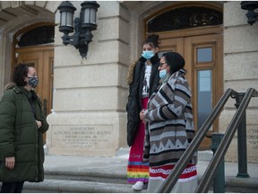 Soolee Papequash, right, stands with her granddaughter La-Hoya Sparvier and speaks to NDP MLA Nicole Sarauer, left, after the pair delivered a petition to Saskatchewan Minister of Corrections, Policing and Public Safety Christine Tell, at the Saskatchewan Legislative Building in Regina, Saskatchewan on Jan. 15, 2020. Papequash said the petition outlined various concerns about conditions in correctional facilities and called for Tell's resignation.