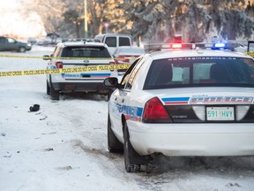 Police cruisers sit out front of a home on the 700 block of Athol Street in Regina, Saskatchewan on Jan. 16, 2021. After responding to a call that a woman had been shot, police found a woman at the scene with what they claim were serious injuries. The woman was transported to hospital.