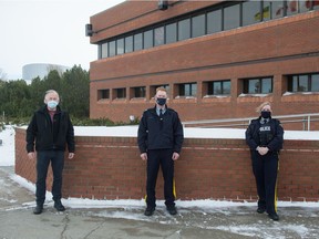 From left, Sgt. Barry Ledoux, Cpl. Owen Third and Cst. Lauren MacDonald, all of the RCMP, stand in front of RCMP 'F Division' headquarters in Regina, Saskatchewan on Jan. 20, 2021. Ledoux works with the Indigenous Policing Unit and is from Muskeg Lake Cree Nation. Third and MacDonald are with the proactive recruiting unit for F Division.