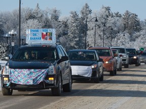 The "Support Dr. Shahab" vehicle parade that began at the Conexus Arts Centre makes its way past the Saskatchewan Legislative Building in Regina, Saskatchewan on Jan. 31, 2021. BRANDON HARDER/ Regina Leader-Post