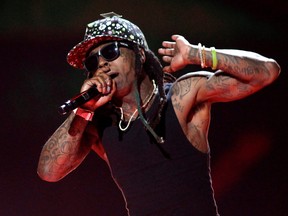 Rapper Lil Wayne performs during the 2015 iHeartRadio Music Festival at the MGM Grand Garden Arena in Las Vegas, Nevada, Sept. 18, 2015.