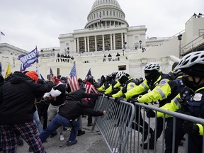Trump supporters try to break through a police barrier at the Capitol in Washington, D.C., on Jan. 6.