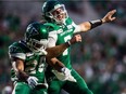 Saskatchewan Roughriders quarterback Cody Fajardo, right, celebrates a touchdown with running back William Powell against the Ottawa Redblacks on Aug. 24, 2019 at Mosaic Stadium.