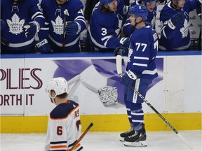 The Toronto Maple Leafs' Adam Brooks, 77, is congratulated by teammates Friday after scoring his first NHL goal.