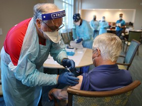 A Florida senior receives an injection of the Pfizer-BioNtech COVID-19 vaccine.