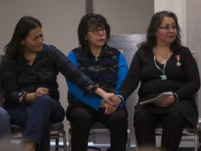 Commissioner Michele Audette (left), Myrna LaPlante and Darlene Okemaysim-Sicotte sit together during the opening ceremonies for the Missing and Murdered Indigenous Women and Girls inquiry in Saskatoon, SK on Monday, November 20, 2017.