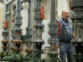 Erwin Beug leans against a bit of piping in this January 2019 photo. The piping is part of the geothermal heating and cooling system in the basement of the Grant Hall Hotel on Moose Jaw's Main Street. Beug and his brother built the small drilling rig that dug each of the some 120 wells at a depth of 150 feet, which serve to heat the water circulating through the system. BRANDON HARDER/ Regina Leader-Post