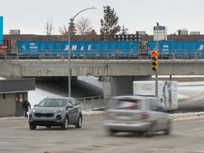 Vehicles travel along Albert Street where it intersects with Saskatchewan Drive.
