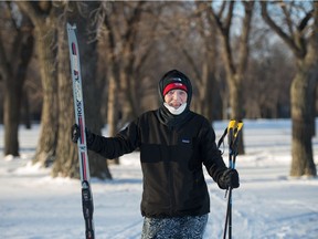 86-year-old Emily Cameron stands with her cross-country skis in Wascana Park in Regina, Saskatchewan on Feb. 4, 2021.