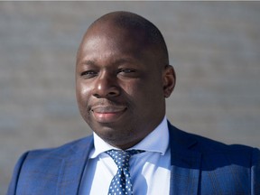 Ronald Ajavon, the CEO / Director of Education of the Conseil des écoles fransaskoises, stands near the École Monseigneur de Laval school in Regina, Saskatchewan on Feb. 18, 2021