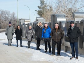 From left, The Leader-Post Foundation board members Bill Johnson, Brenda Indzeoski, Janice Dockham, Irene Seiberling, Jeff Epp and Jim Toth, along with the University of Regina Journalism School's Mark Taylor, stand in front of the University's sign on campus in Regina, Saskatchewan on Feb. 19, 2021.