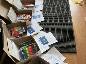 Barbara Meneley puts together art supply kits to be mailed out to participants in Studio Without Walls, an art program for isolated seniors taught over the phone.