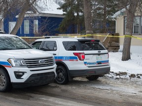 Police work at the scene of a death investigation on the 1000 block of Garnet Street in Regina on Feb. 21, 2021.