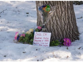 A memorial of flowers is seen in front of a home on the 1000 block of Garnet Street, where on Feb. 21 police found a man fatally injured, in Regina, Saskatchewan on Feb. 23, 2021.

BRANDON HARDER/ Regina Leader-Post