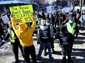 Calgary police were busy keeping peace as hundreds of anti-mask protesters and counter-protesters faced off at City Hall in Calgary on Saturday, February 27, 2021.