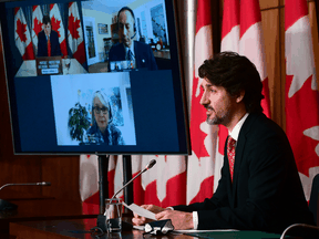Prime Minister Justin Trudeau holds a news conference on the COVID-19 vaccine rollout, joined virtually by ministers and government officials in Ottawa on Friday, Feb. 26, 2021.