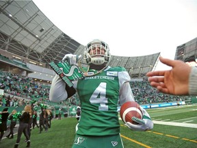 Saskatchewan Roughriders linebacker Cameron Judge is shown with the team's big-play chain after returning an interception for a touchdown against Edmonton on Nov. 2, 2019, when the Green and White clinched first place in the CFL's West Division.