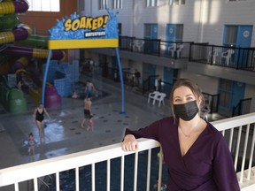 Kendi Danbrook, event and engagement coordinator, poses for a photo near the waterpark at The Atlas Hotel. Some Saskatchewan businesses are encouraging people to staycation during the Feb. 13-15 long weekend.