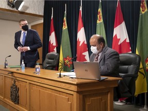 Regina, SASK. : February 16, 2021 -- Premier Scott Moe and Chief Medical Health Officer Saqib Shahab at a COVID-19 news conference. MICHAEL BELL / Regina Leader-Post