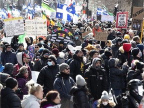 A large crowd gathers to protest against government COVID-19 health orders to wear masks, keep a safe distance from others and to protest against vaccinations in Montreal on Saturday, March 13, 2021.