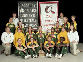 The University of Regina Cougars are shown after winning the 2001 Canadian university women's basketball championship. Seated in front row (left to right): Jana Schweitzer, Cymone Bouchard, Corrin Wersta, Phoebe De Ciman. Kneeling: Dave Taylor (assistant coach), Kate Stefan (student trainer), Crystal Heisler, Leah Anderson, Rumali Werapitiya, Erin Walton (student trainer), Kaela McKaig (injured player). Second-last row: Bree Burgess, Becky Poley, Tara-Lee Crosson, Heather Dedman, Sheena Aitken. Standing beside banners: Christine Stapleton (head coach, left), Diane Hilko (assistant coach, right).