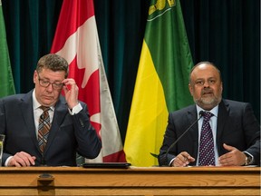 Saskatchewan Premier Scott Moe listens to Saskatchewan's Chief Medical Health Officer Dr. Saqib Shahab address questions from members of the media to give an update on the province's response to COVID-19 back in the early stages of the pandemic on March 13, 2020.