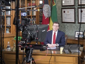 Premier Scott Moe and sign language interpreter Karen Nurkowski rehearse before their live TV address to the province of Saskatchewan on April 22.