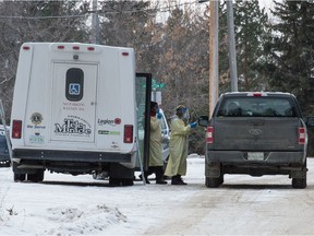 Workers approach a pickup truck at a mobile COVID-19 testing station in Indian Head, Sask. on Nov. 20, 2020. BRANDON HARDER files