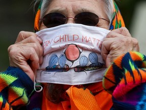 Maria Linklater wears an orange shirt and mask that reads "every child matters" to raise awareness of the devastating impact of the residential school system on indigenous people. Photo taken in Saskatoon on Tuesday, September 29, 2020.
