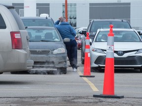 Drivers sit in lineups waiting to receive the COVID-19 vaccine at Evraz Place in Regina, Sask. on March 16, 2021. BRANDON HARDER files