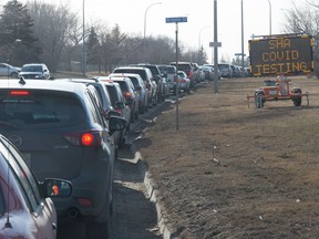 A vaccine lineup is seen running down Saskatchewan Drive, near Mosaic Stadium, in Regina, Saskatchewan on Mar. 16, 2021. The lineup started on the Evraz Place grounds, went south on Lewvan Drive and east on Saskatchewan Drive back to Elphinstone Street.