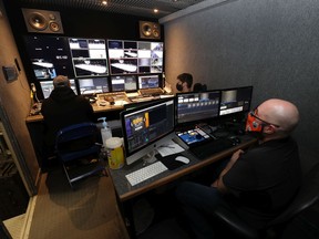 The interior of the production truck for the IKS Live's scoverage of the WHL's East Division hub. Pictured, from left, are Bryce Aschenbrenner (technical directer) Joel Mihilewicz (replay) and Ryan Borowko (producer). Keith Hershmiller Photography.