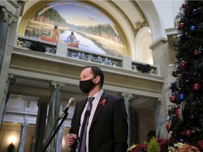 NDP Leader Ryan Meili speaking to reporters at the Saskatchewan Legislative Building last December.