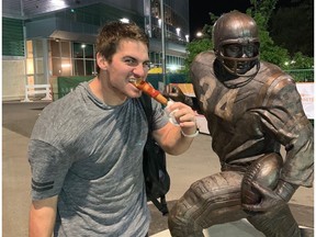 Product-placement opportunities are appetizing for Saskatchewan Roughriders quarterback Cody Fajardo, shown enjoying a corn dog outside Mosaic Stadium after a 2019 victory over the Hamilton Tiger-Cats, and other prominent CFL players.