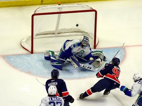 The Regina Pats' Connor Bedard scores on Swift Current Broncos goalie Reid Dyck on Wednesday at the Brandt Centre.