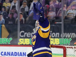 Saskatoon Blades' Nolan Maier celebrates his record-setting 86th WHL victory on Wednesday at the Brandt Centre.