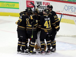 Brandon Wheat Kings celebrate a 4-3 victory over the Winnipeg Ice on Thursday at the Brandt Centre.
